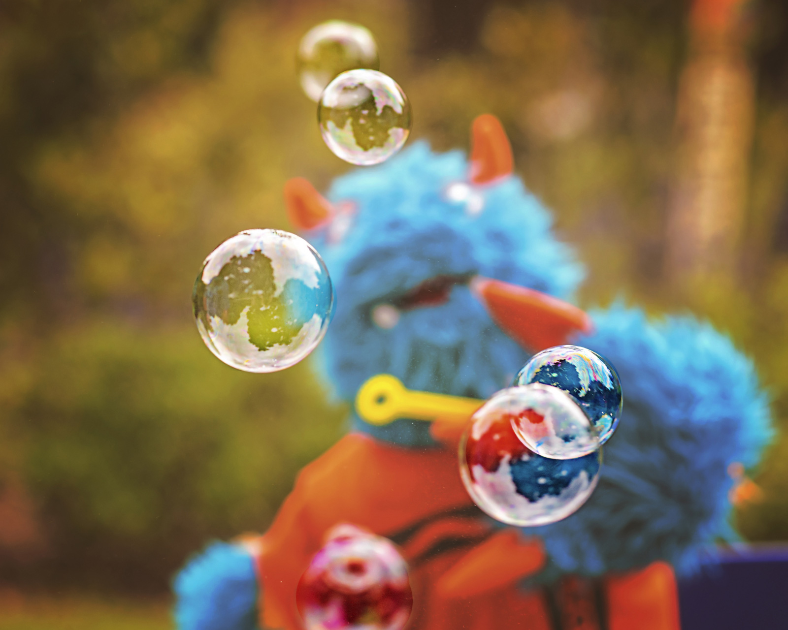 Blueper blowing bubbles