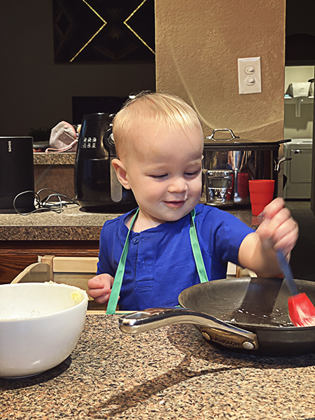 Baby in the kitchen cooking
