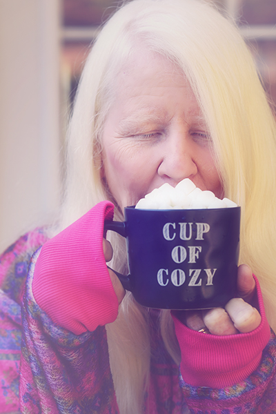 Holding a cup of hot chocolate
