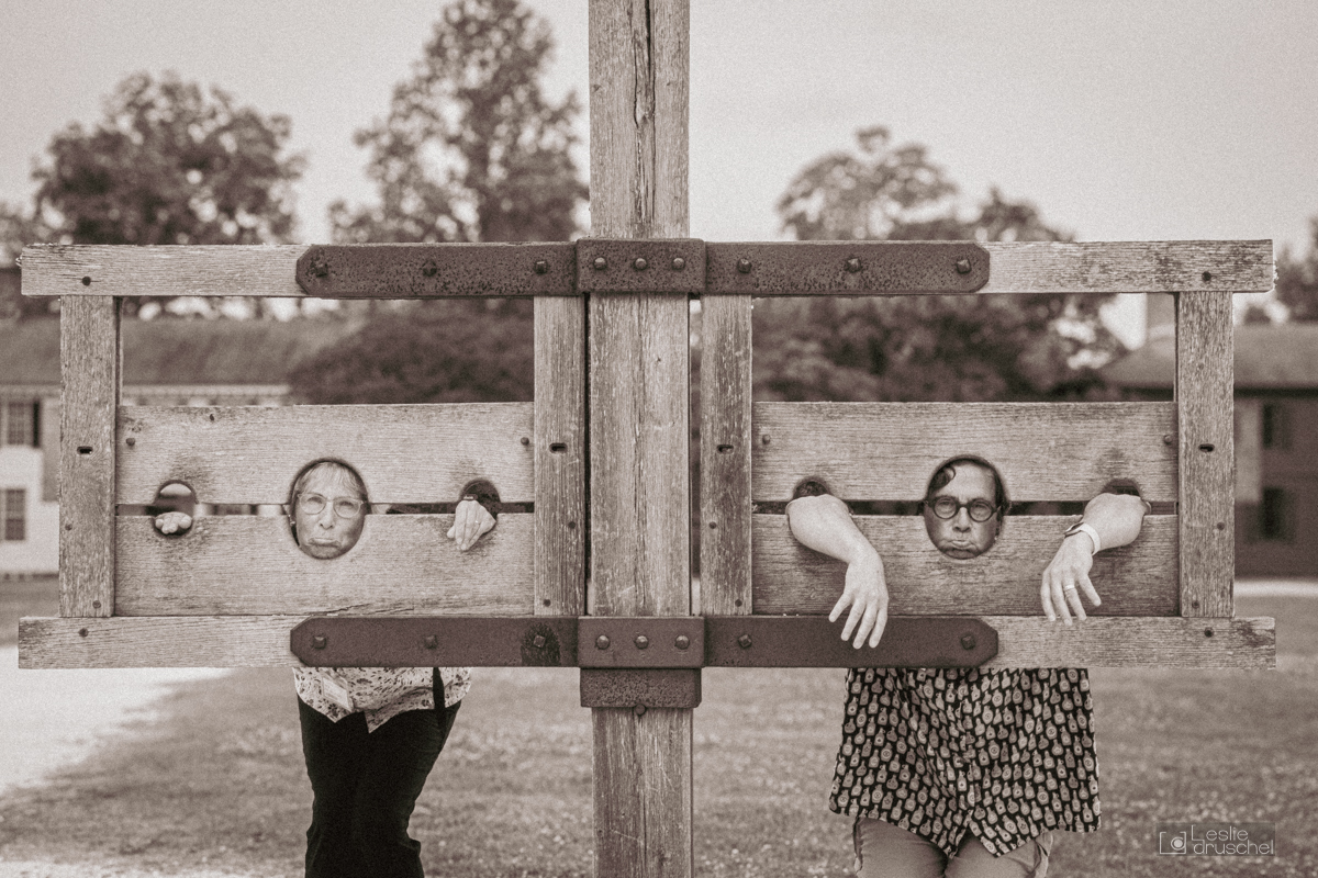  2 people in the pillory. Humorous.