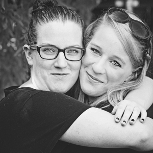 Black and white photo of sisters hugging