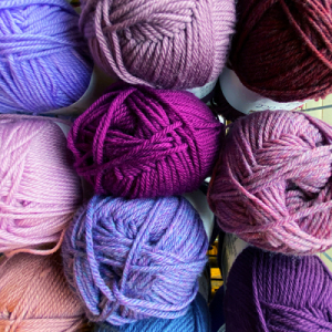 purple yarn in a basket